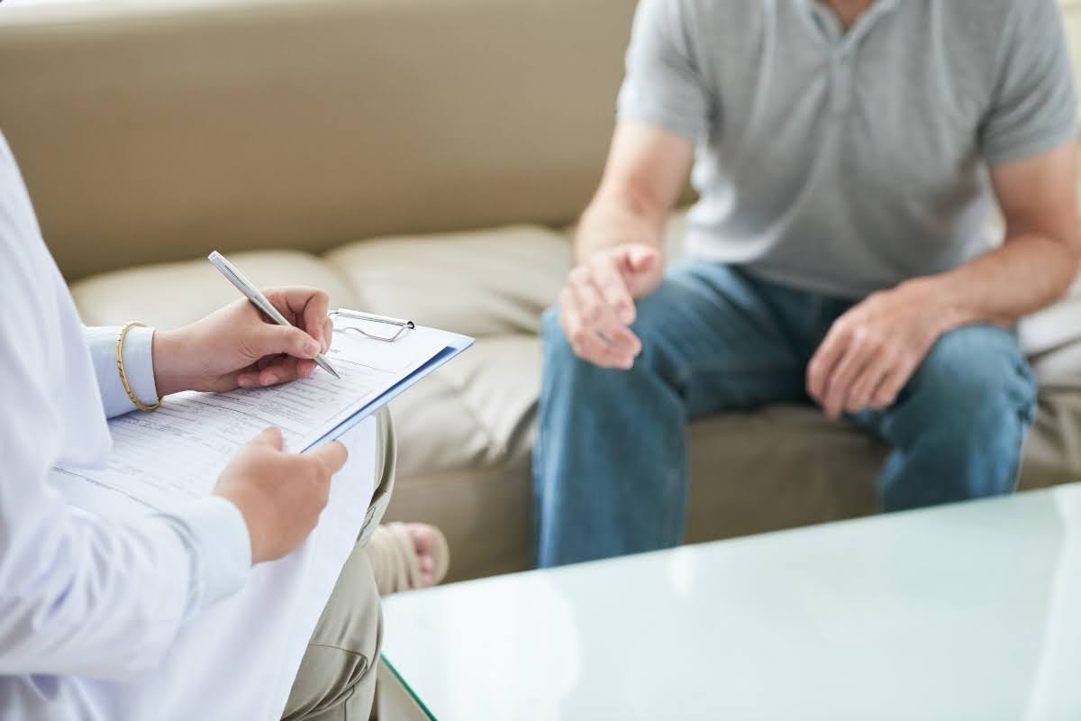 A psychiatric nurse in a session with a patient.